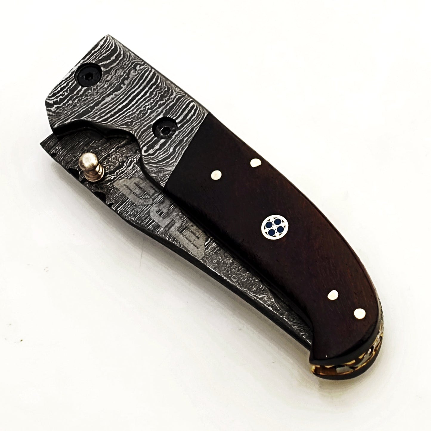Ruddock Bros folding knife with black hardwood handle and Damascus steel with Damascus steel blade with leather sheath Ruddock El Paso Texas