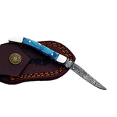 Ruddock Bros slim folding pocket knife with resin plastic handle and Damascus steel blade and leather sheath Ruddock El Paso Texas