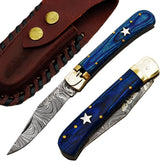 Ruddock Bros folding knife with blue hardwood handle and Damascus steel blade with spring assist includes leather sheath Ruddock El Paso Texas