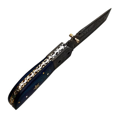 Ruddock Bros folding knife with blue hardwood and Damascus Steel handle and blade. Complete with leather sheath Ruddock El Paso Texas