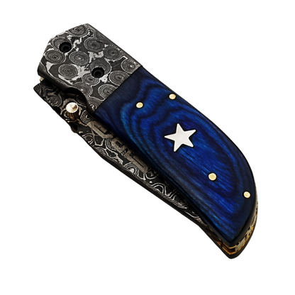 Ruddock Bros folding knife with blue hardwood and Damascus Steel handle and blade. Complete with leather sheath Ruddock El Paso Texas
