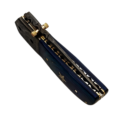 Ruddock Bros folding knife with blue hardwood and Damascus Steel handle and blade. Complete with leather sheath Ruddock El Paso Texas