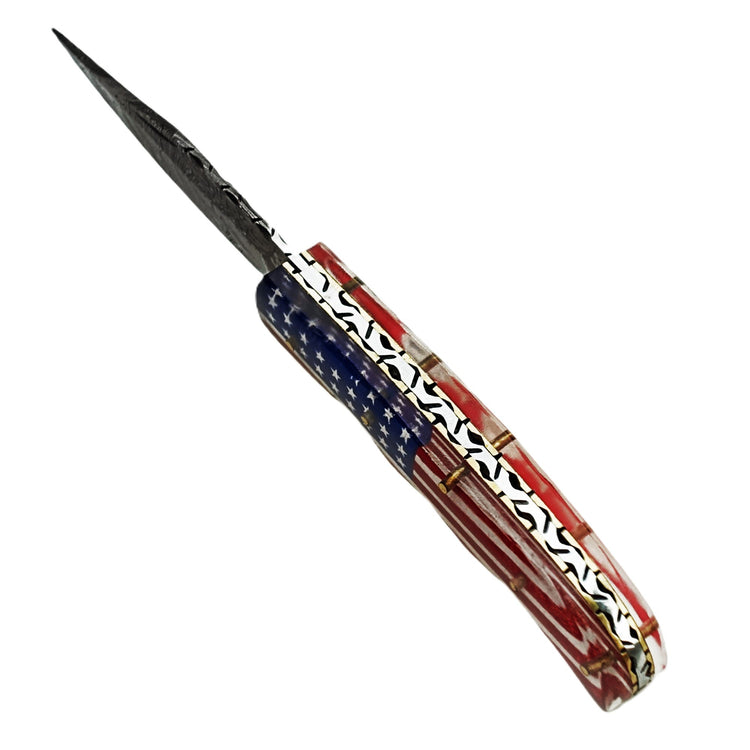 Ruddock Bros folding knife with plastic resin handle in American Flag pattern and Damascus steel blade with leather sheath Ruddock El Paso Texas