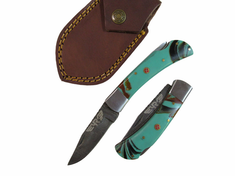 turquoise colored resin handle folding knife with Damascus steel blade  by Ruddock Bros El Paso Texas